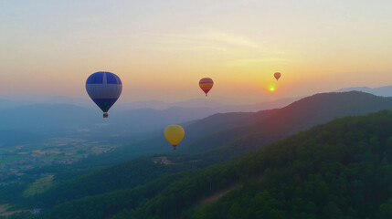 Fototapeta premium Hot air balloons flying over green mountain landscape during sunset