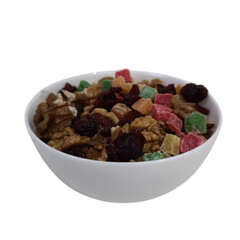 A white bowl filled with a mix of walnuts, cranberries, and candied fruits on a light background. Healthy snack or ingredient concept