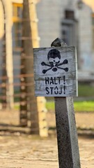 &ldquo;Historic Auschwitz memorial site showing buildings, fences and quiet remembrance atmosphere.&rdquo;