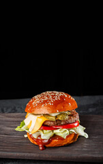 gourmet cheeseburger with sesame bun, melted cheese, lettuce, tomato, and pickles on a rustic wooden board. Ideal for food photography, menus, and advertisements