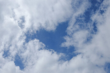 Obraz premium Background pattern and texture of white clouds and blue sky in summer. Condition of the sky during the day. Copy space for text. Concept of climate and weather. For graphic design, 3D rendering and ba