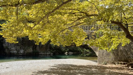 Traditional Papigko village with stone buildings, narrow streets and mountain nature.