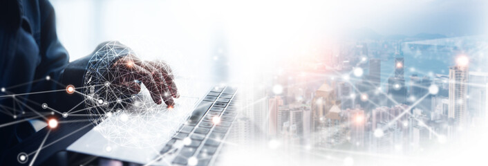Digital technology, internet global network communication technology concept. Business man using laptop computer with global internet network connection, smart city as background, data exchange