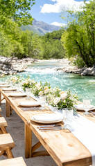 Obraz premium Elegant outdoor wedding reception table beside a river