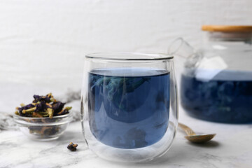 Delicious butterfly pea flower tea on white marble table