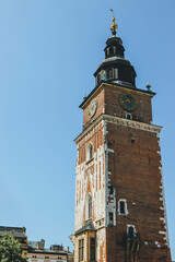 Naklejka premium old town main square tower in krakow city with many colorful towers and buildings