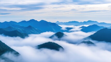 Peaceful view of mountains with clouds below