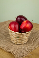 Red beautiful apples in a basket on the table. Red apples. Apple diet