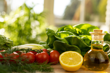 Red tomatoes, lettuce leaves on the table closeup. Vegetables for salad on table