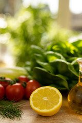 Red tomatoes, lettuce leaves on the table closeup. Vegetables for salad on table