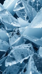 Obraz premium Shattered Ice Blue Glass Fragments on Dark Background Texture