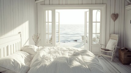 A bright white bedroom with an open door overlooking the sea