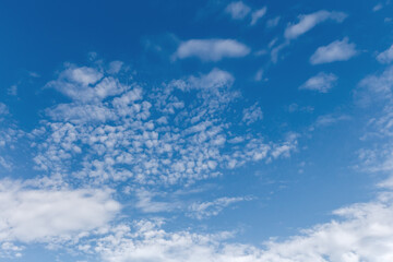 Blue sky with stratocumulus clouds at summer sunny day