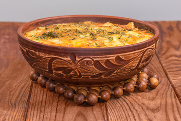 Prepared potato casserole with crust of melted cheese, front view