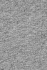 Grey knitted fabric texture. Fabric knitted from threads of natural cotton with addition of...