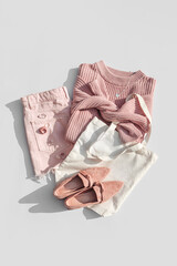 Fashion spring outfit. Pale pink jumper with eco bag  jeans and loafers. Women's stylish and...