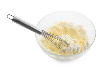 Bowl and whisk with delicious cream isolated on white