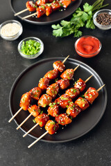 Teriyaki chicken skewers on plate