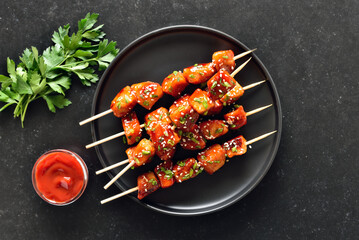 Teriyaki chicken skewers on plate