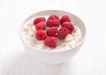 Tasty oatmeal porridge with raspberries