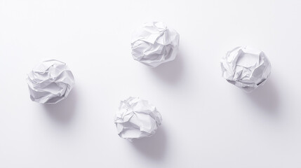 Crumpled paper balls forming a creative sculpture, symbolizing teamwork and innovation.