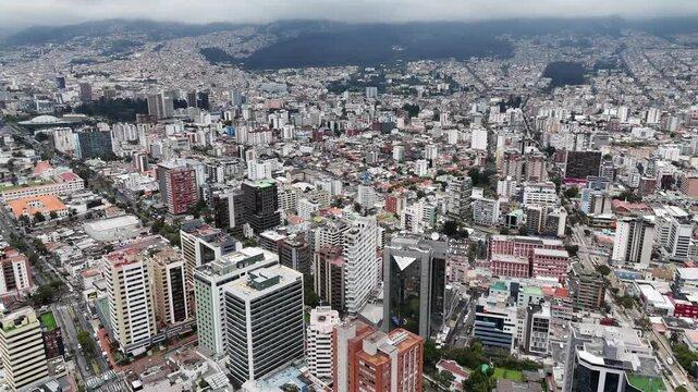 Aerial footage of the city Quito in Ecuador with the Volcan mountain on background