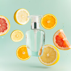 Refreshing citrus beauty serum in elegant glass bottle surrounded by floating lemon, orange, and grapefruit slices on pastel background. Concept of vitamin-rich skin care, hydration and natural beauty