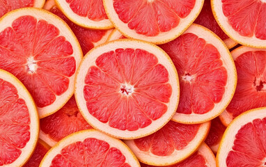 Fresh grapefruit slices as background