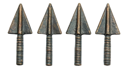 Set of four ancient metal arrowheads with distinctive triangular tips