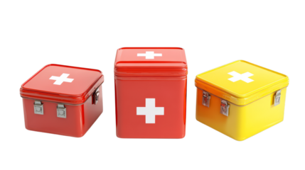 Colorful first aid kits with white cross in red, orange, and yellow metal boxes