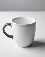 Obraz premium Minimalist ceramic coffee mug on a pure white background.