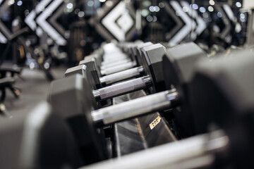 Naklejka premium Gym to emphasis and focus on dumbbells. Concept of professional training, sport and motivation.