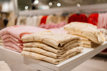 Women's clothing in a modern shopping center store. Shopping, clothing and discount concept.