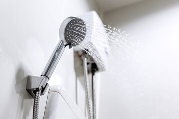 Running shower with water heater. Concept of energy efficient technology, modern comfort and energy...