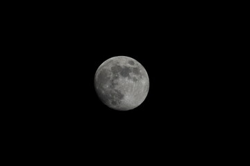 Beautiful full moon on a black background wallpaper. Beautiful full moon in a dark night. Moon...
