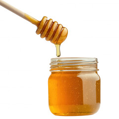 Honey dripping from wooden dipper into a glass jar.