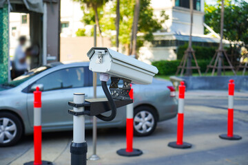 CCTV camera surveillance on car parking Safety system area Condominium,  copy space.