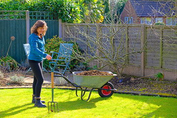 Reaching for the garden fork, in spring time.