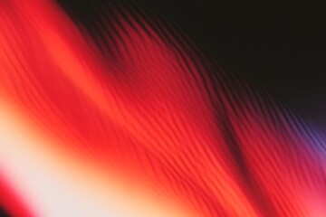Abstract image showing vibrant red streaks against a dark background