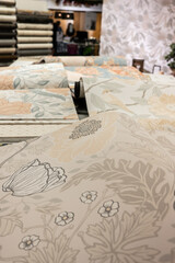 Rolls of wallpaper on a table.