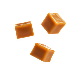 Caramel cubes flying in air isolated on white background. Set of delicious caramel candies floating isolated on white background. caramel cubes. 