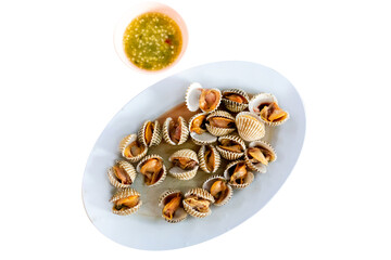 Top view of Boiled Cockle with seafood sauce, focus selective