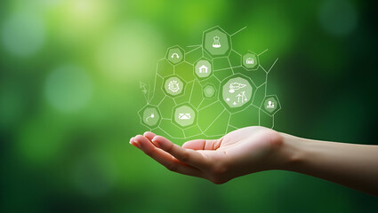 Hand Holding Environment Icons Connected Through Network on Green Background: A Concept of Technology, Environmental Protection, and Renewable Sustainable Energy Sources