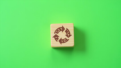 Exploring the Circular Economy: Wooden Cubes Symbolizing Sustainable Business Growth and Resource Reuse on a Green Background - A Concept for Future Design and Renewable Materials