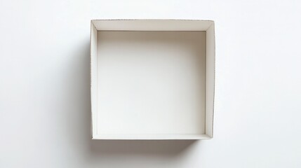 A blank white cardboard box viewed from a top-down perspective, centered in the image with a pure white backdrop emphasizing its simplicity and emptiness