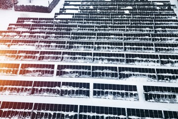 Melting snow on solar power panels outdoors