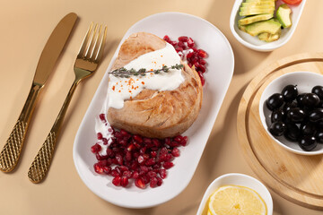 A bowl of tasty salad with tinned tuna and vegetables on a beige marble table, flat plan. Place for text