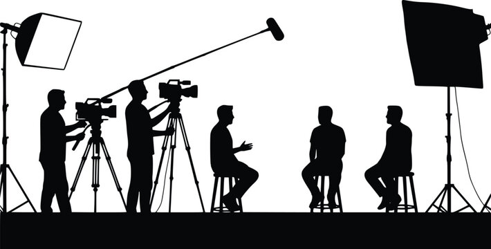 Black silhouette of a film production scene with a camera operator, boom mic holder, and three crew members seated, capturing a behind-the-scenes interview or talk show setup