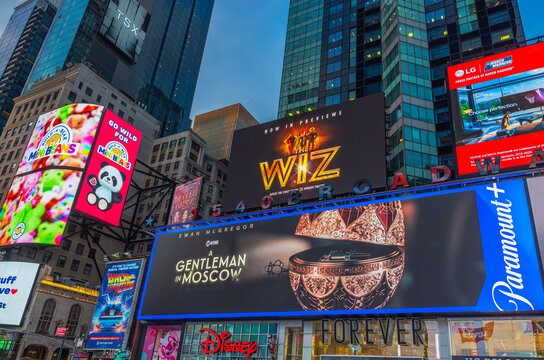 Bright billboards and digital advertisements on skyscrapers at Times Square in New York during evening. New York. USA. 