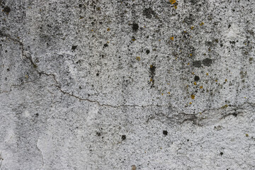 Old cracked and peeling wall close-up.